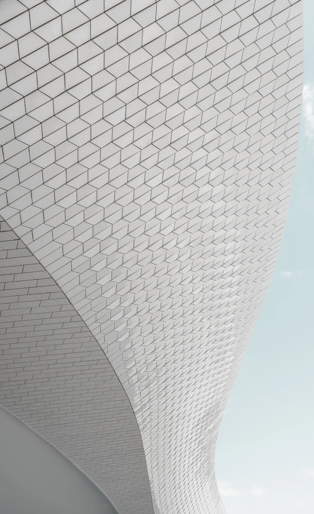 Bayfront Pavilion — a sweeping white tiled facade curving against the sky