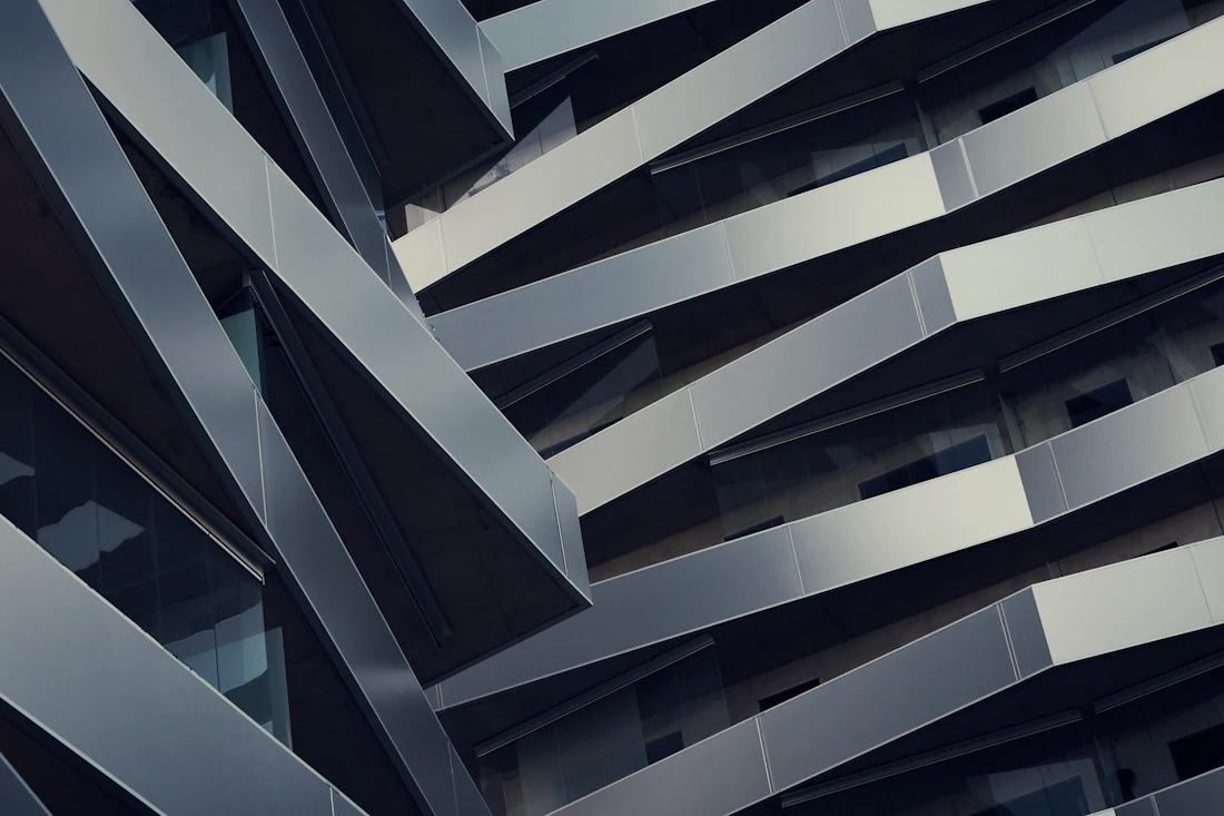 The Foundry — folded steel balconies on a dark angular facade