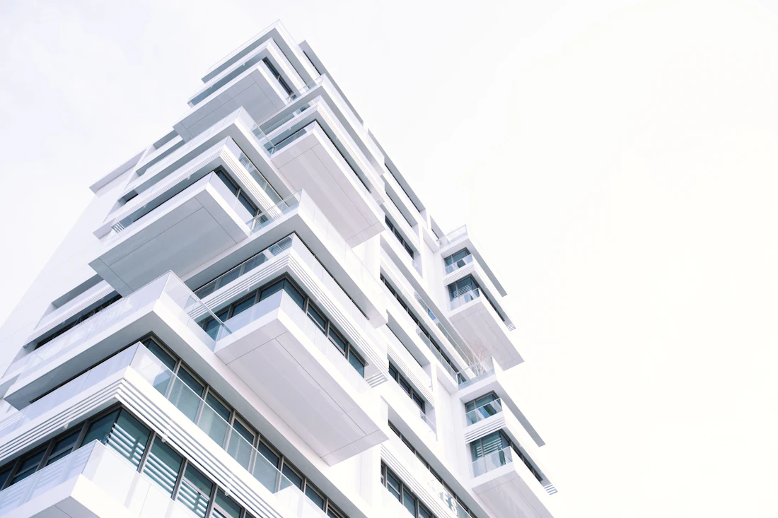 Meridian Terraces — stacked white cantilevered balconies stepping up a residential tower